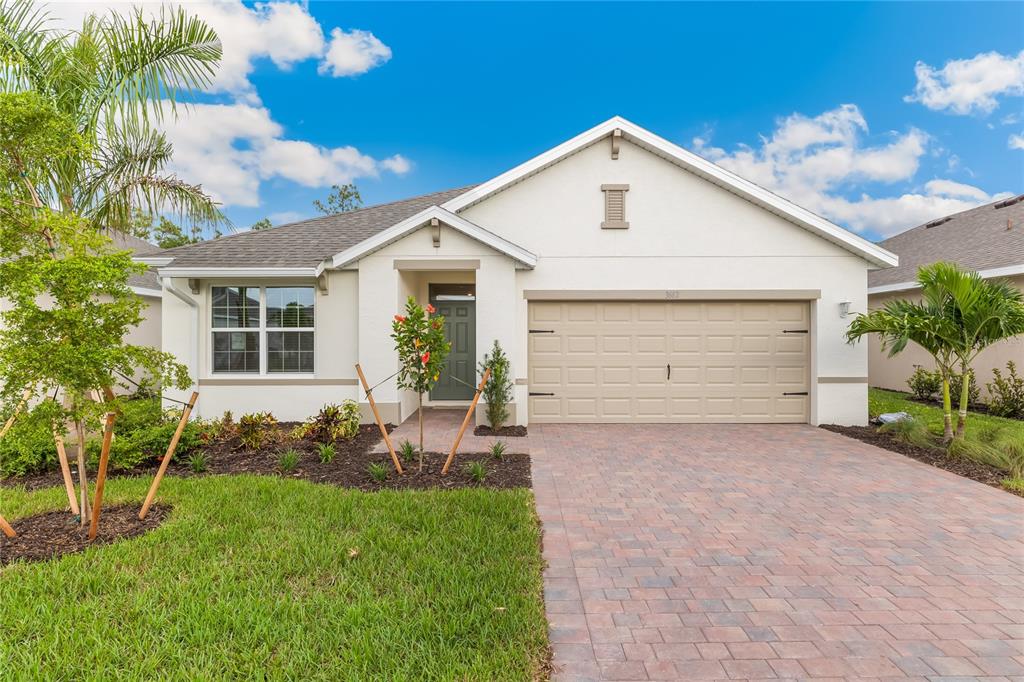 9504 Turtle Grass Circle Punta Gorda, FL 33950 - Photo 1 of 21 a front view of a house with a yard and garage