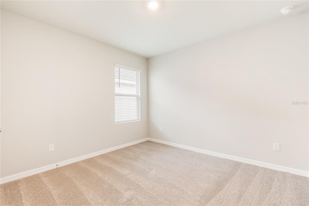 9504 Turtle Grass Circle Punta Gorda, FL 33950 - Photo 11 of 21 a view of an empty room with a window