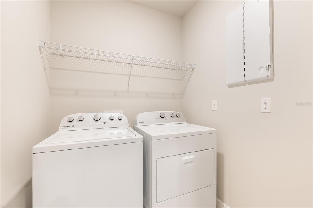 9504 Turtle Grass Circle Punta Gorda, FL 33950 - Photo 15 of 21 a utility room with dryer and washer