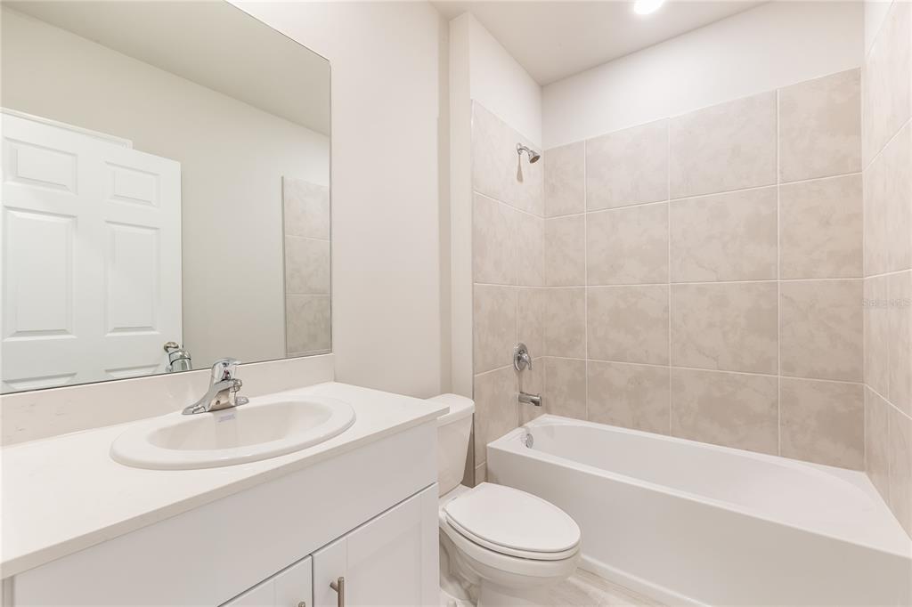 9504 Turtle Grass Circle Punta Gorda, FL 33950 - Photo 16 of 21 a bathroom with a sink toilet and a bathtub