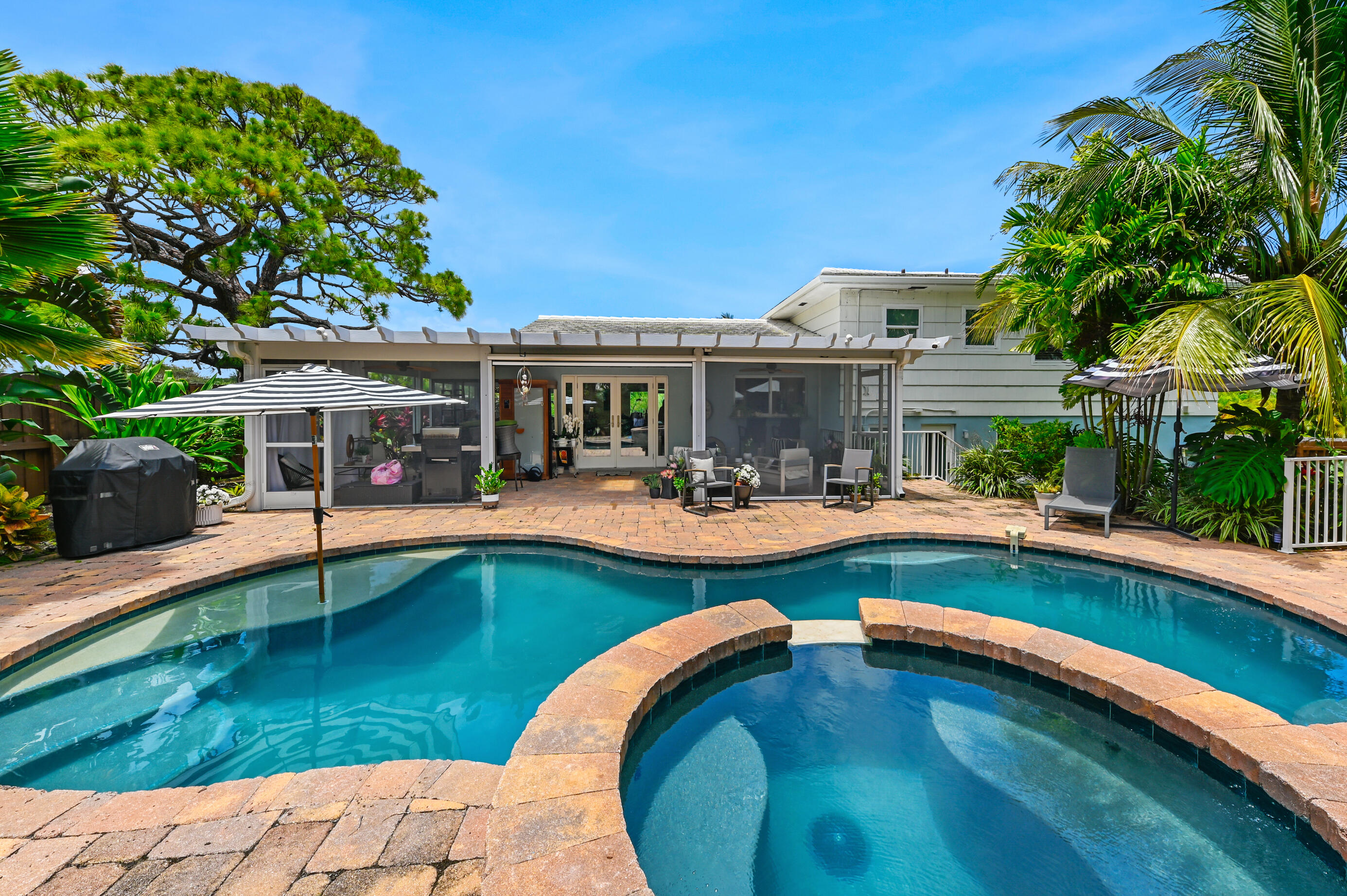 600 Mission Hill Road Boynton Beach, FL 33435 - Photo 1 of 42 a swimming pool with outdoor seating and yard