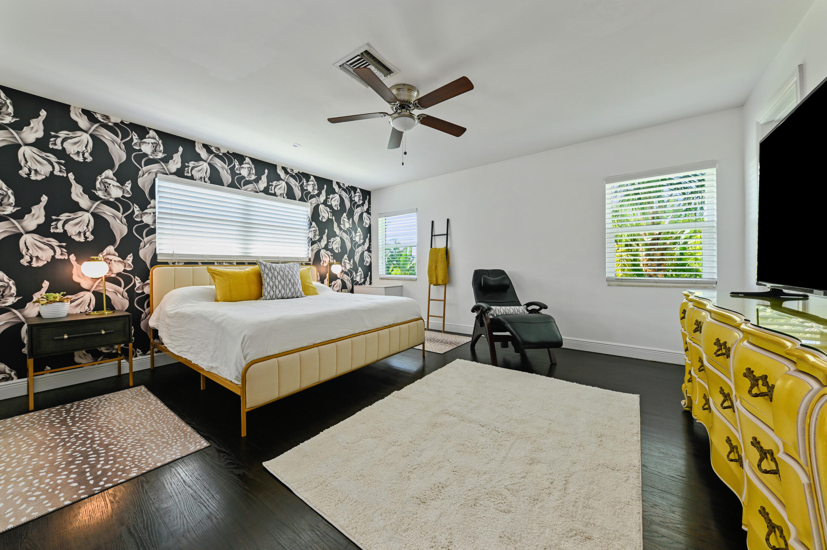 600 Mission Hill Road Boynton Beach, FL 33435 - Photo 15 of 42 a bedroom with a bed and a flat tv screen on dresser