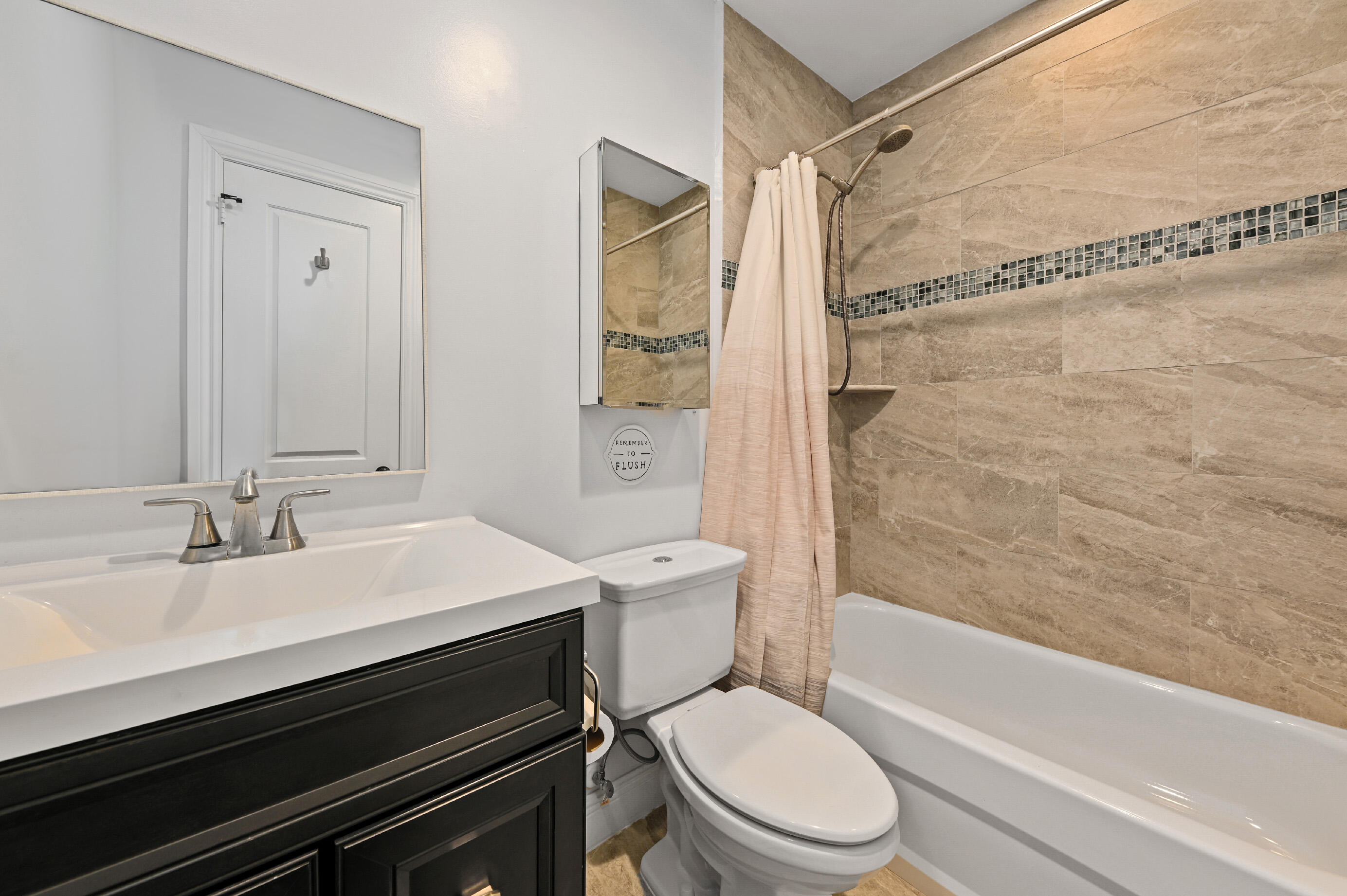 600 Mission Hill Road Boynton Beach, FL 33435 - Photo 23 of 42 a bathroom with a sink a toilet and a bathtub