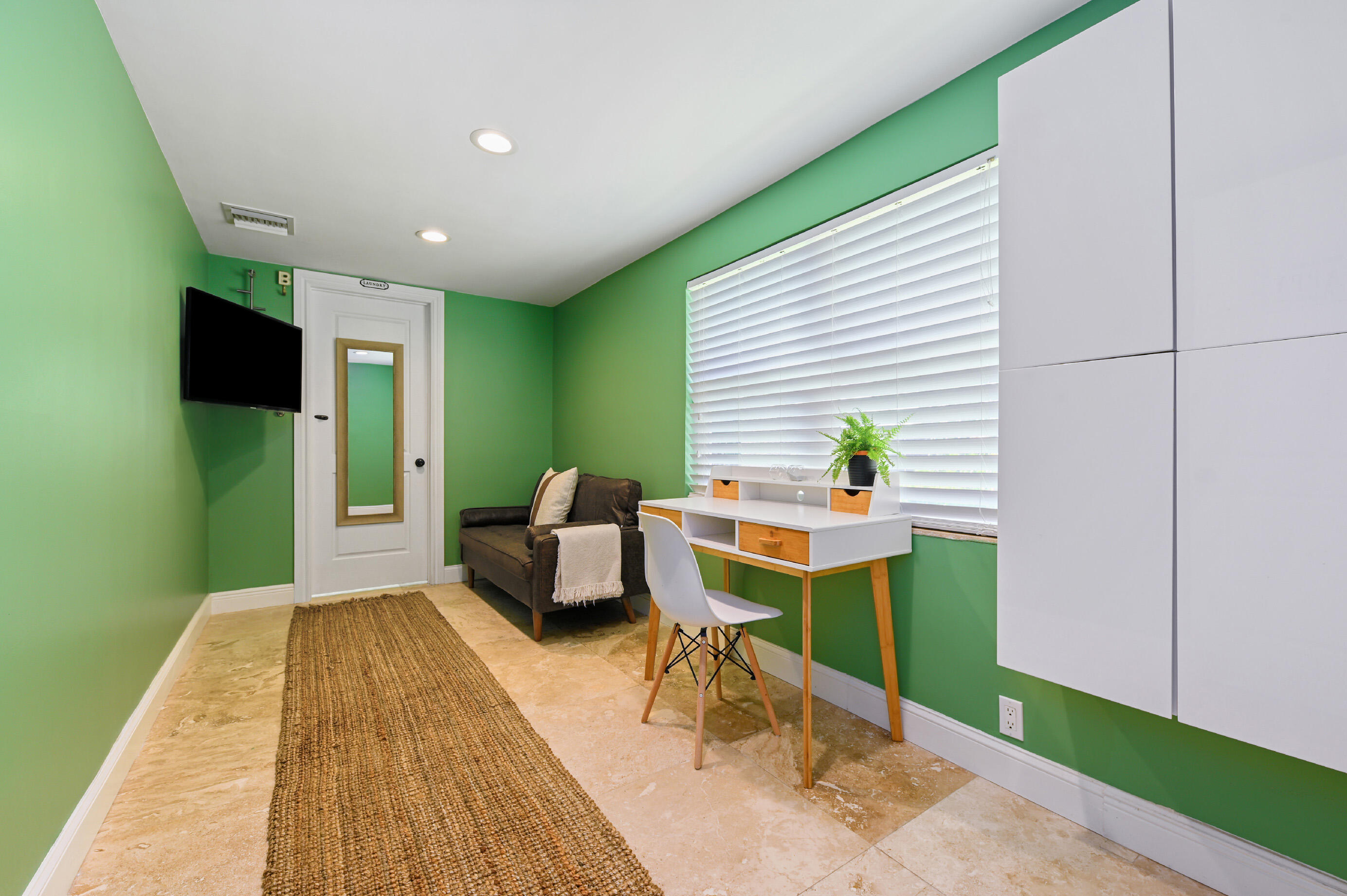 600 Mission Hill Road Boynton Beach, FL 33435 - Photo 24 of 42 a view of a workspace with furniture and a window