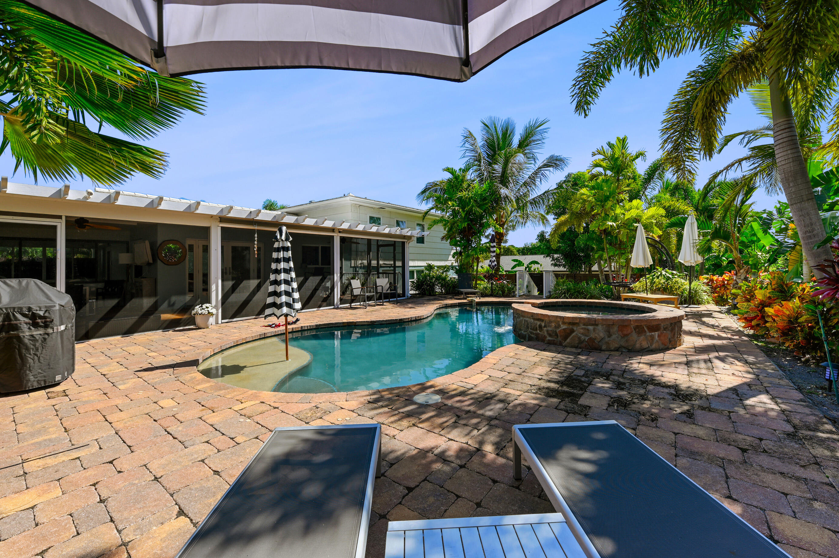 600 Mission Hill Road Boynton Beach, FL 33435 - Photo 28 of 42 a view of a swimming pool with a patio