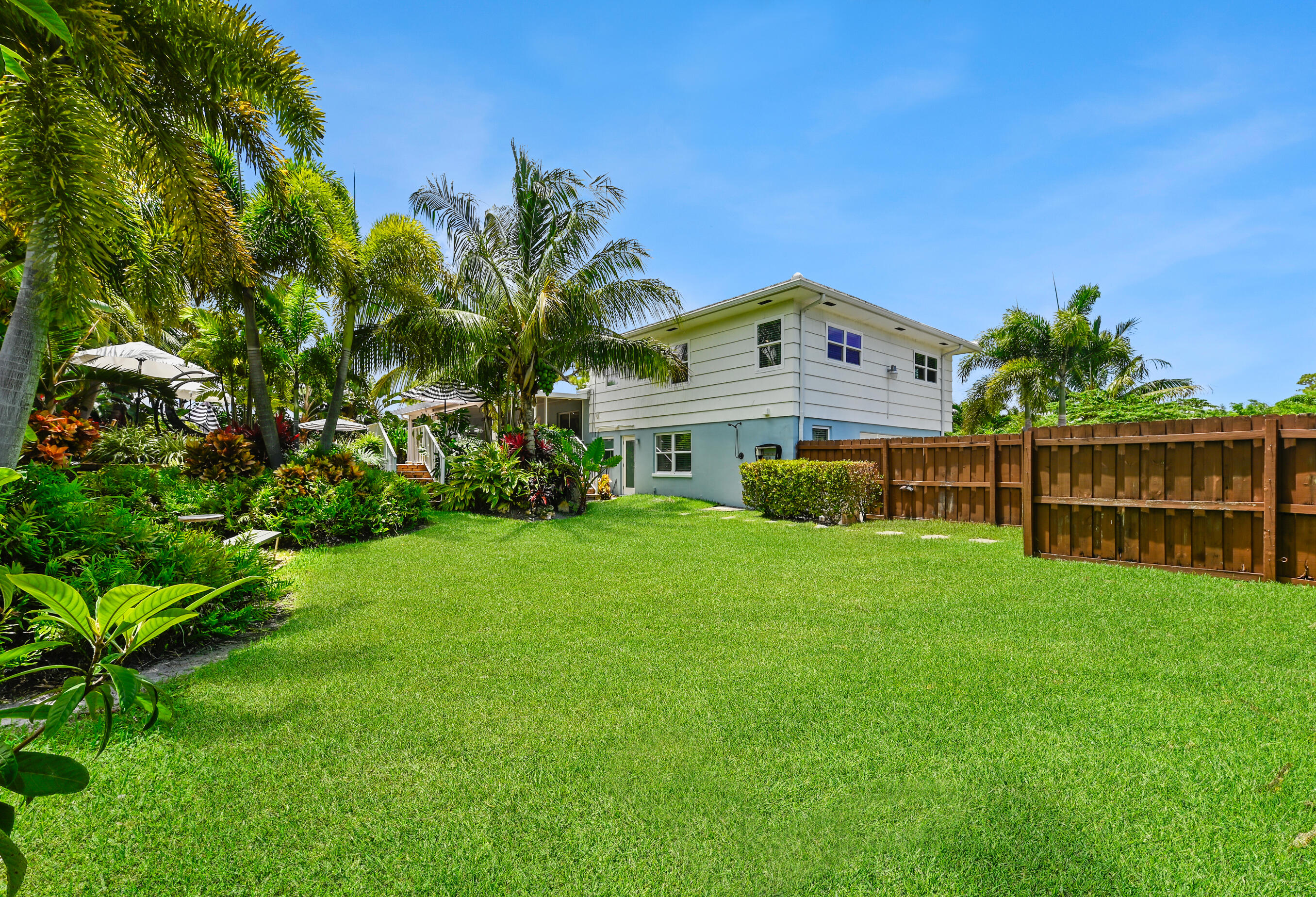 600 Mission Hill Road Boynton Beach, FL 33435 - Photo 35 of 42 a front view of a house with a garden