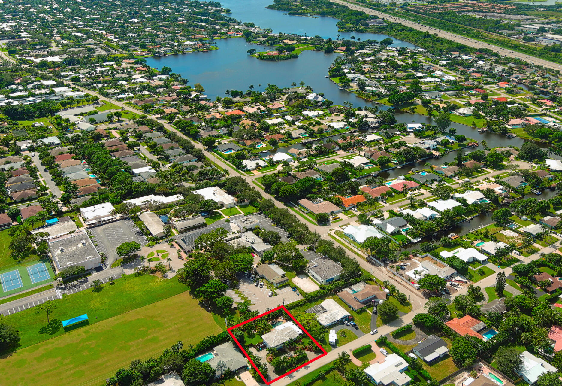 600 Mission Hill Road Boynton Beach, FL 33435 - Photo 40 of 42 an aerial view of residential houses with outdoor space and trees