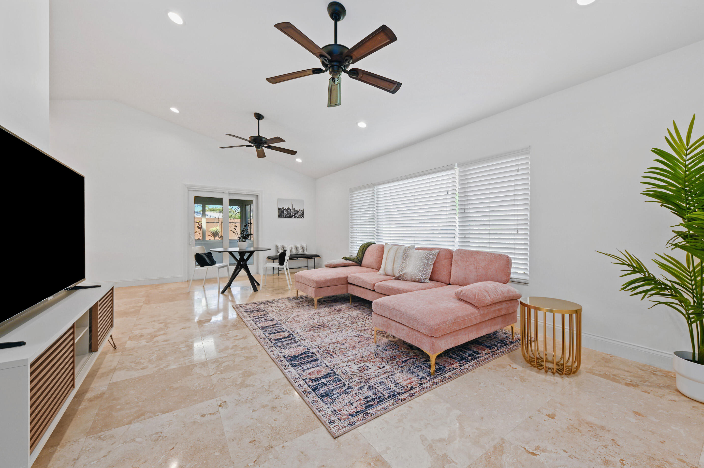 600 Mission Hill Road Boynton Beach, FL 33435 - Photo 8 of 42 a living room with furniture and a flat screen tv