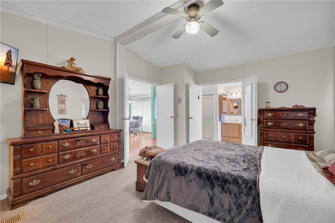 721 Cedar Crest Trail Walhalla, SC 29691 - Photo 15 of 47 An inviting bedroom offers soft carpeting and convenient access to the adjoining bathroom and another living space.