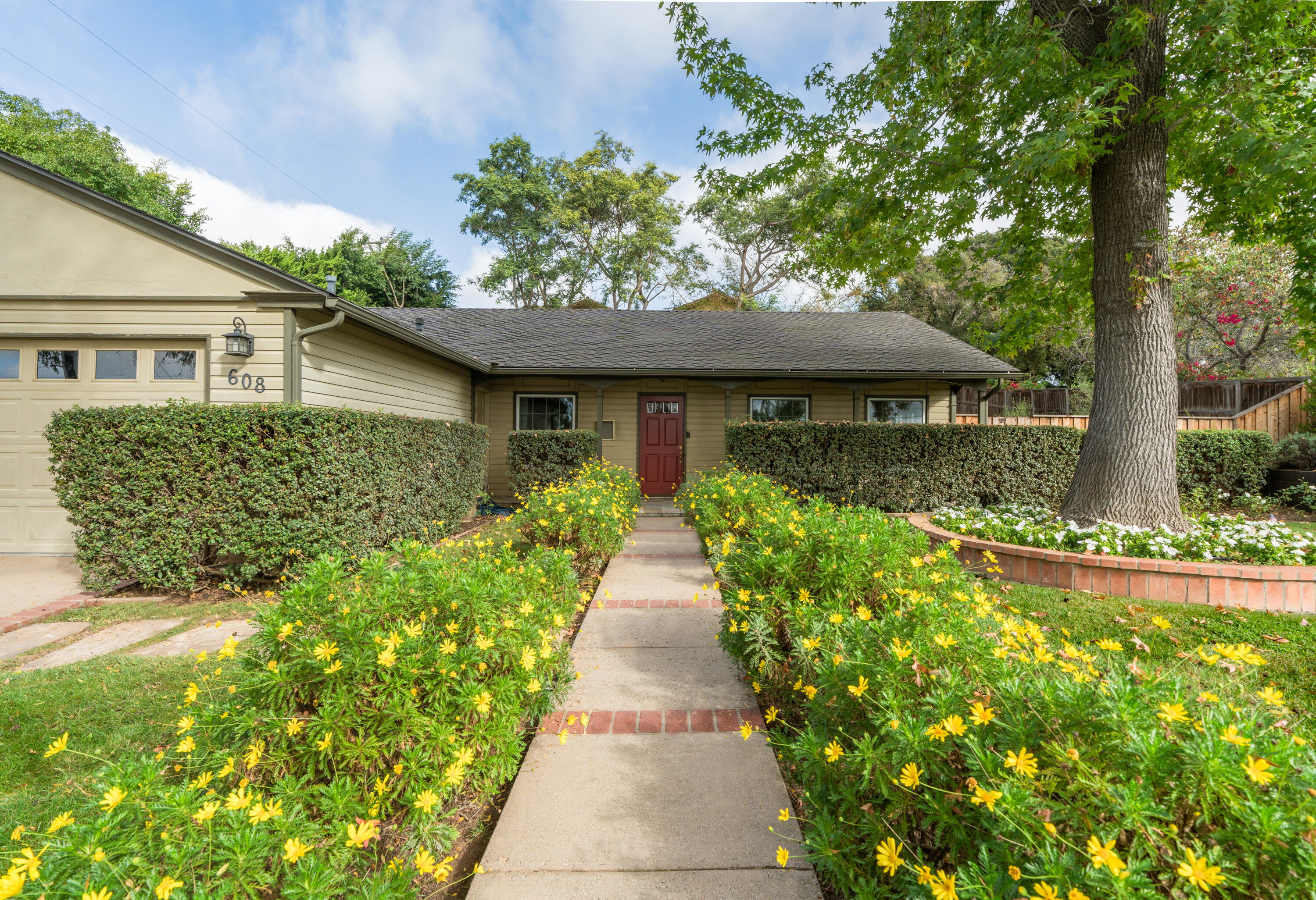 a front view of a house with garden