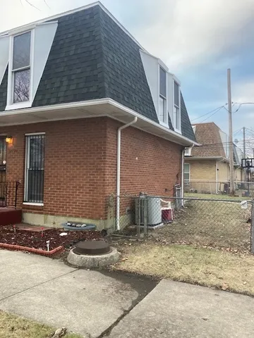 a front view of a house with garage