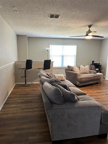 a bathroom with a double vanity sink toilet and shower