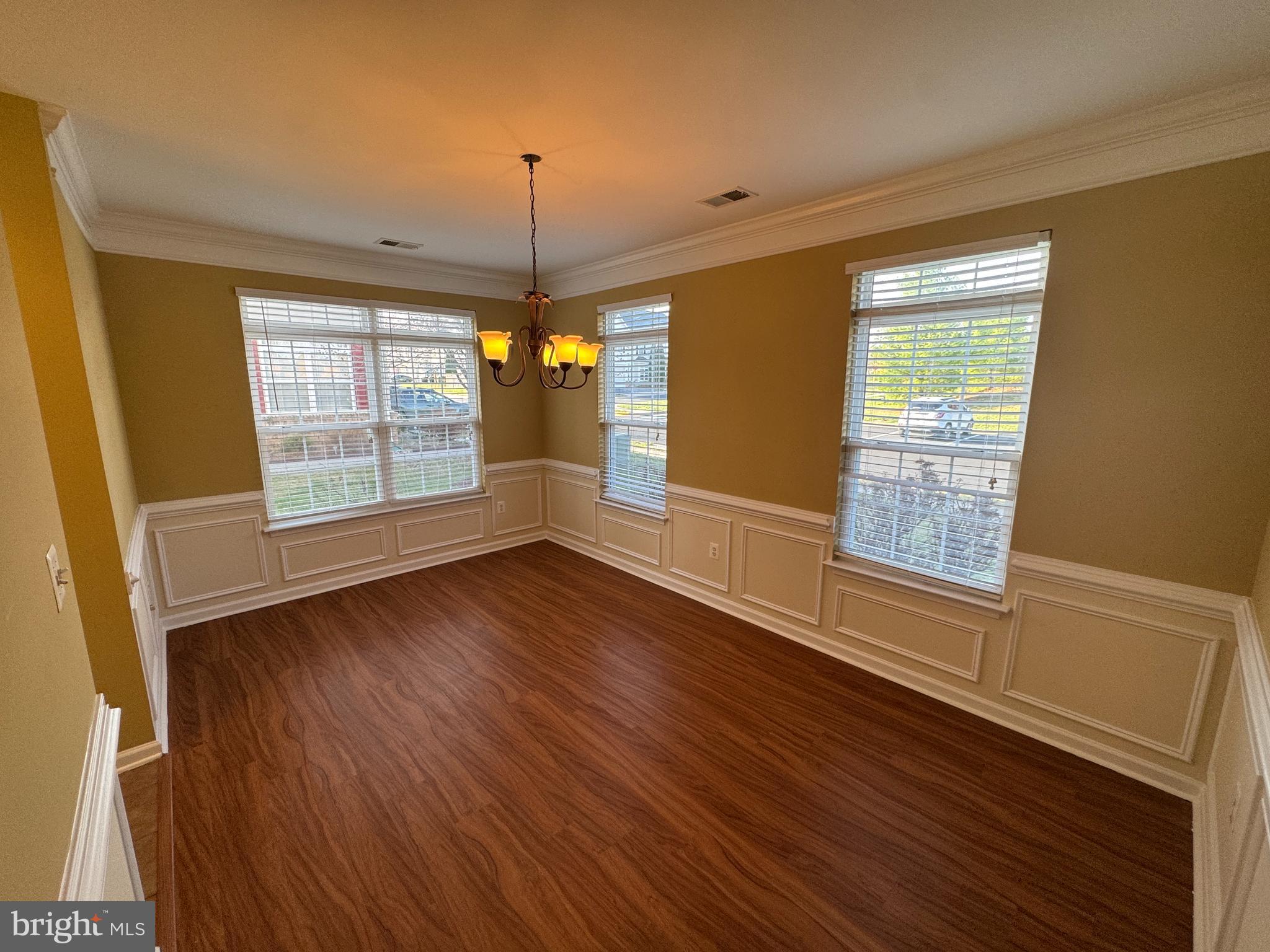 400 Kintyre Lane Stephens City, VA 22655 - Photo 13 of 33 a view of an empty room with wooden floor and a window