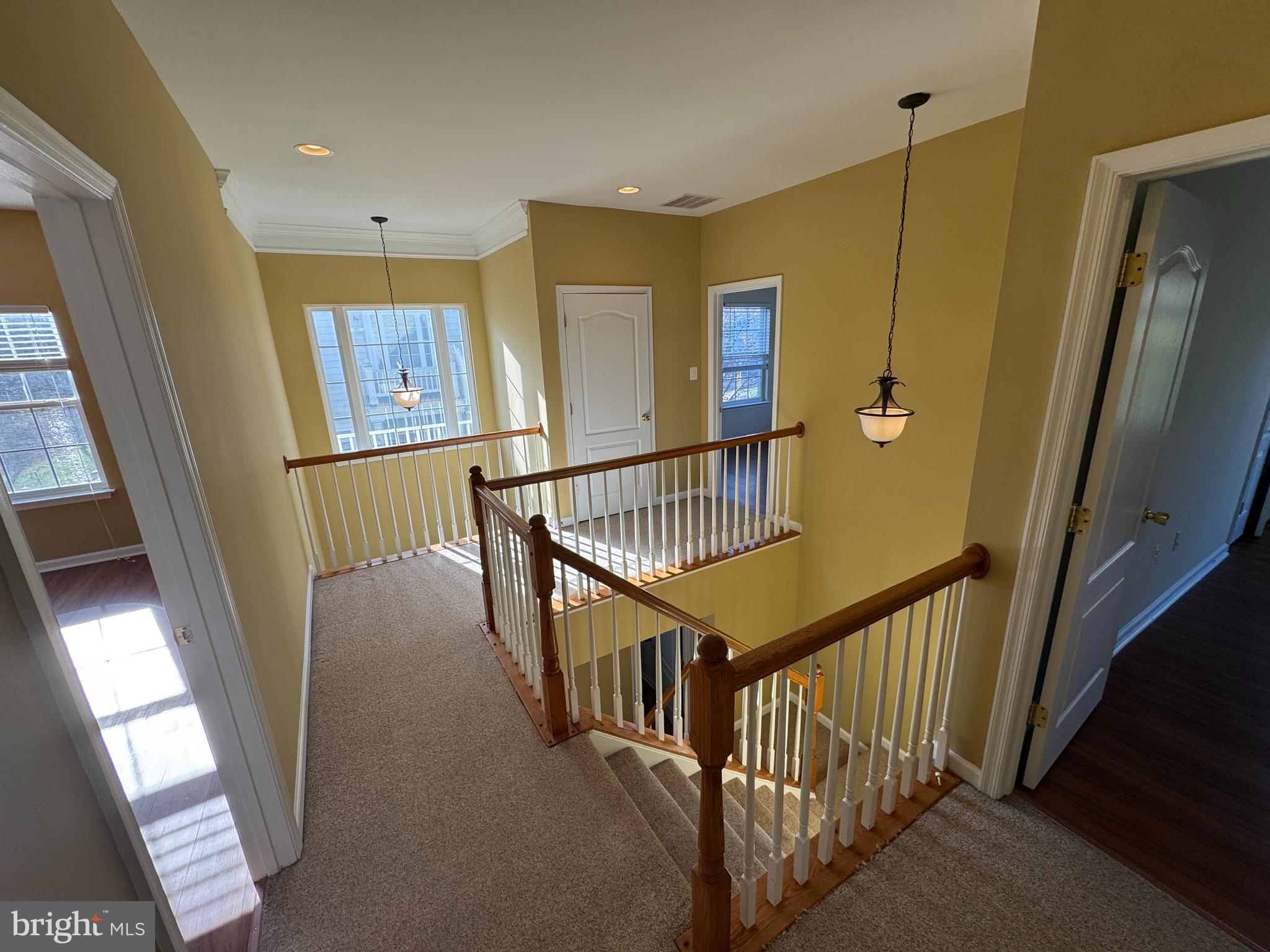 400 Kintyre Lane Stephens City, VA 22655 - Photo 15 of 33 a view of staircase with lots of frames on wall and a window