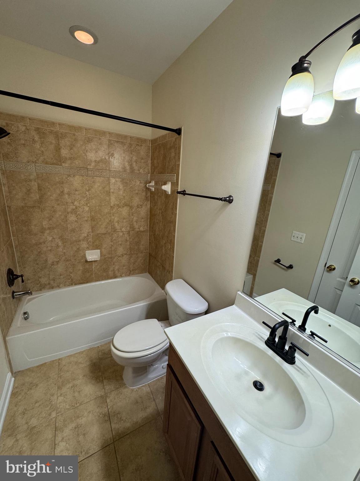 400 Kintyre Lane Stephens City, VA 22655 - Photo 18 of 33 a bathroom with a sink a toilet a mirror a vanity and bathtub