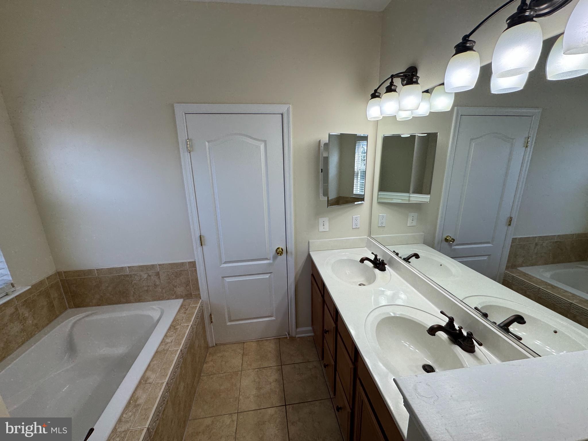 400 Kintyre Lane Stephens City, VA 22655 - Photo 23 of 33 a bathroom with a tub sink and mirror