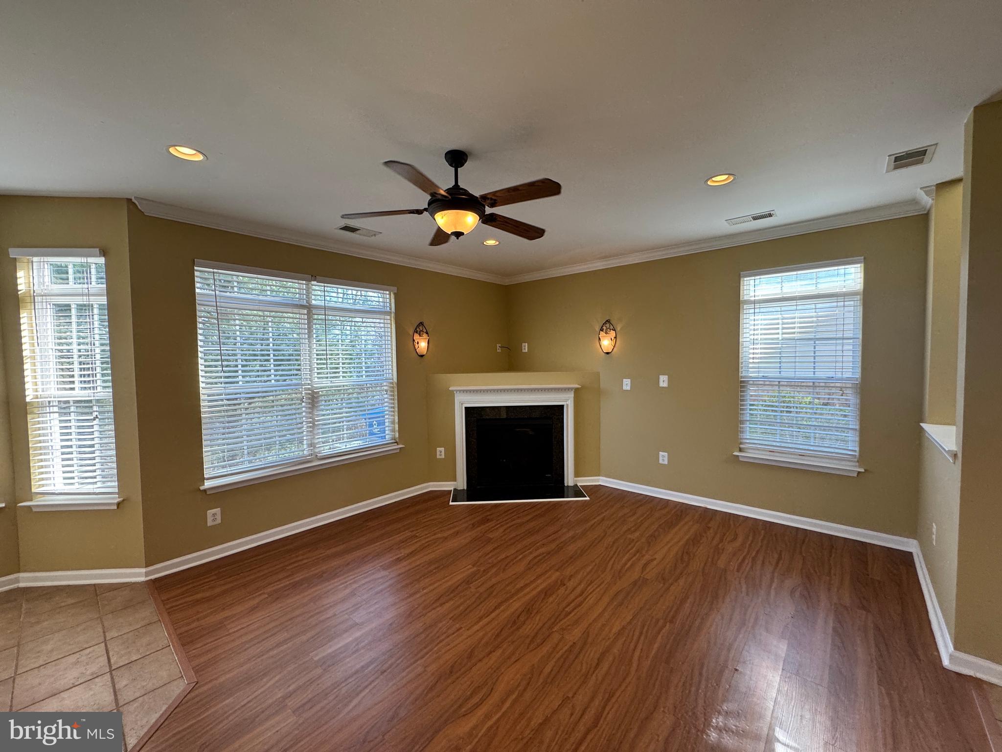400 Kintyre Lane Stephens City, VA 22655 - Photo 6 of 33 a view of an empty room with a fireplace and a window