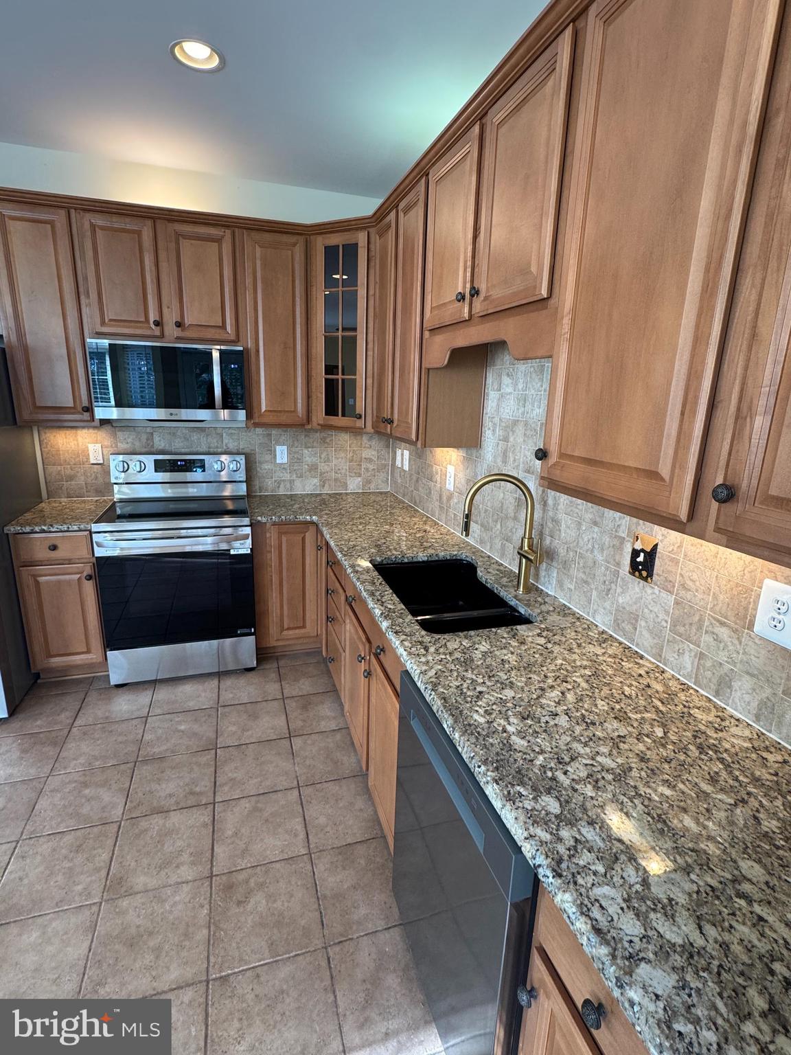 400 Kintyre Lane Stephens City, VA 22655 - Photo 10 of 33 a kitchen with stainless steel appliances granite countertop a sink stove and refrigerator