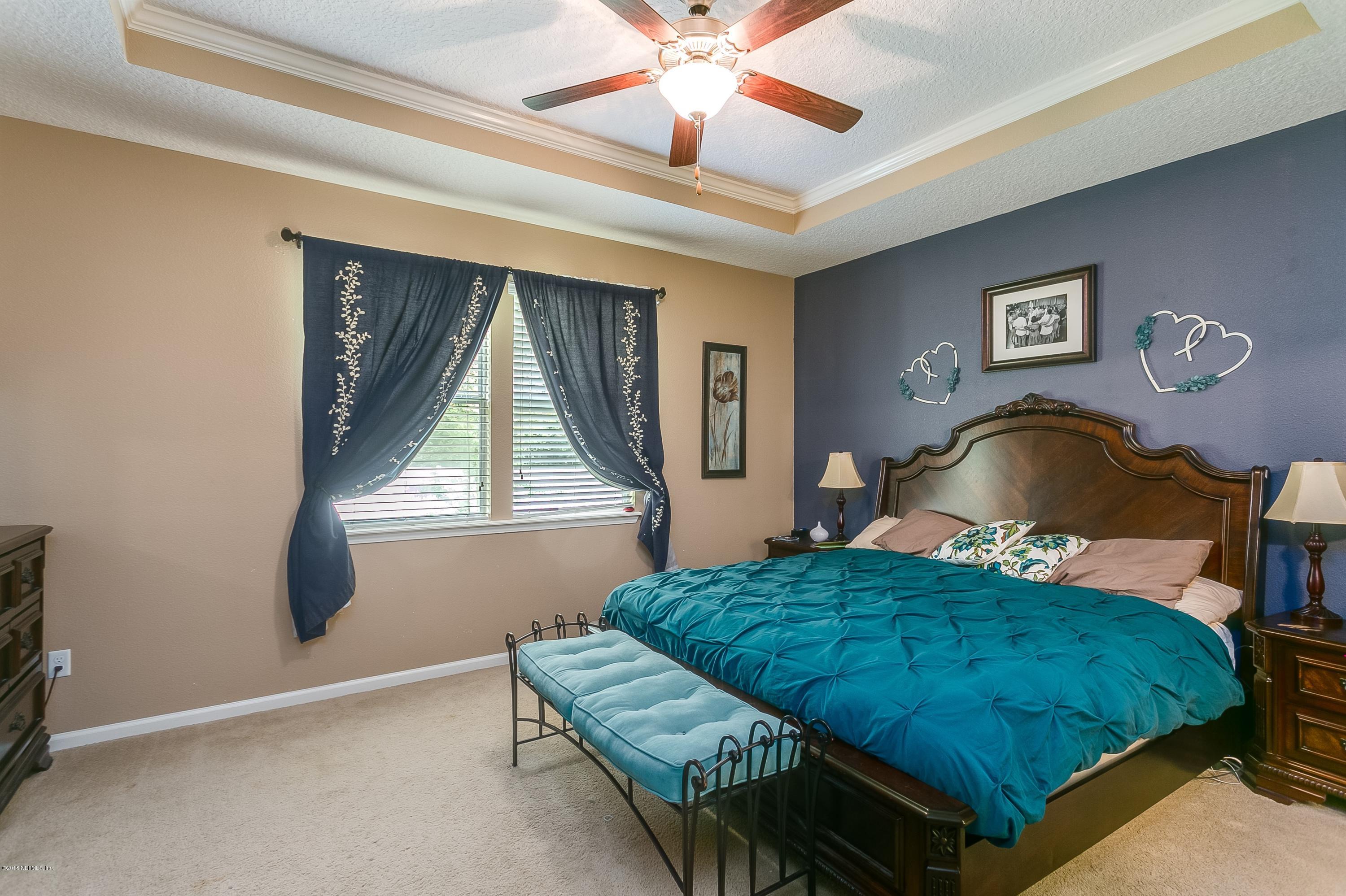 16378 Tisons Bluff Road Jacksonville, FL 32218 - Photo 13 of 24 a bedroom with a bed and window