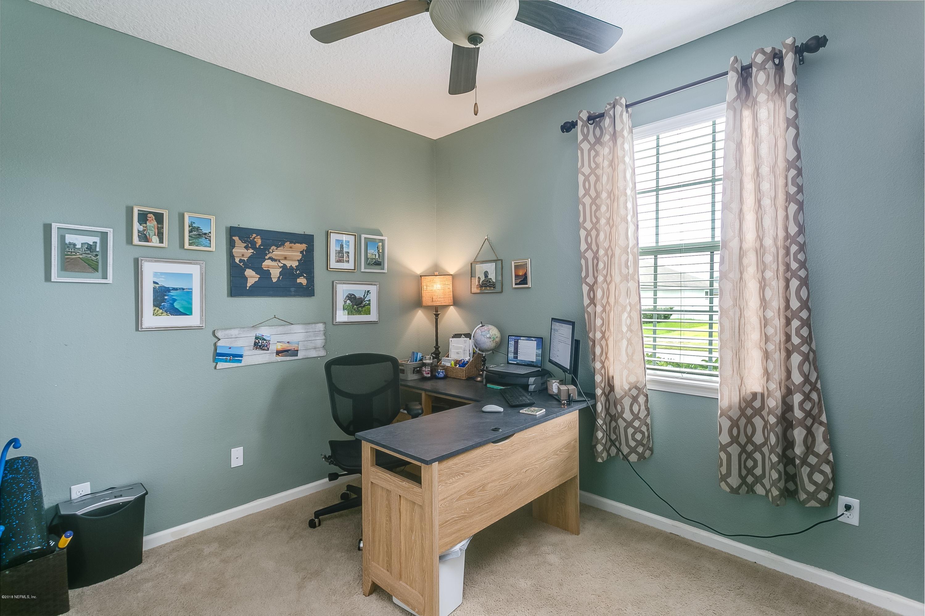 16378 Tisons Bluff Road Jacksonville, FL 32218 - Photo 17 of 24 a living room with furniture and a window