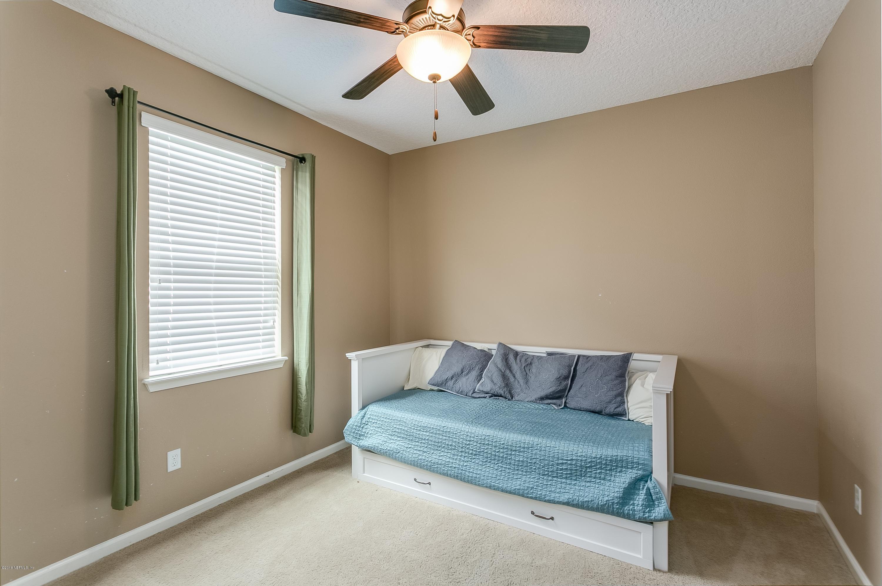 16378 Tisons Bluff Road Jacksonville, FL 32218 - Photo 20 of 24 a living room with furniture and a window
