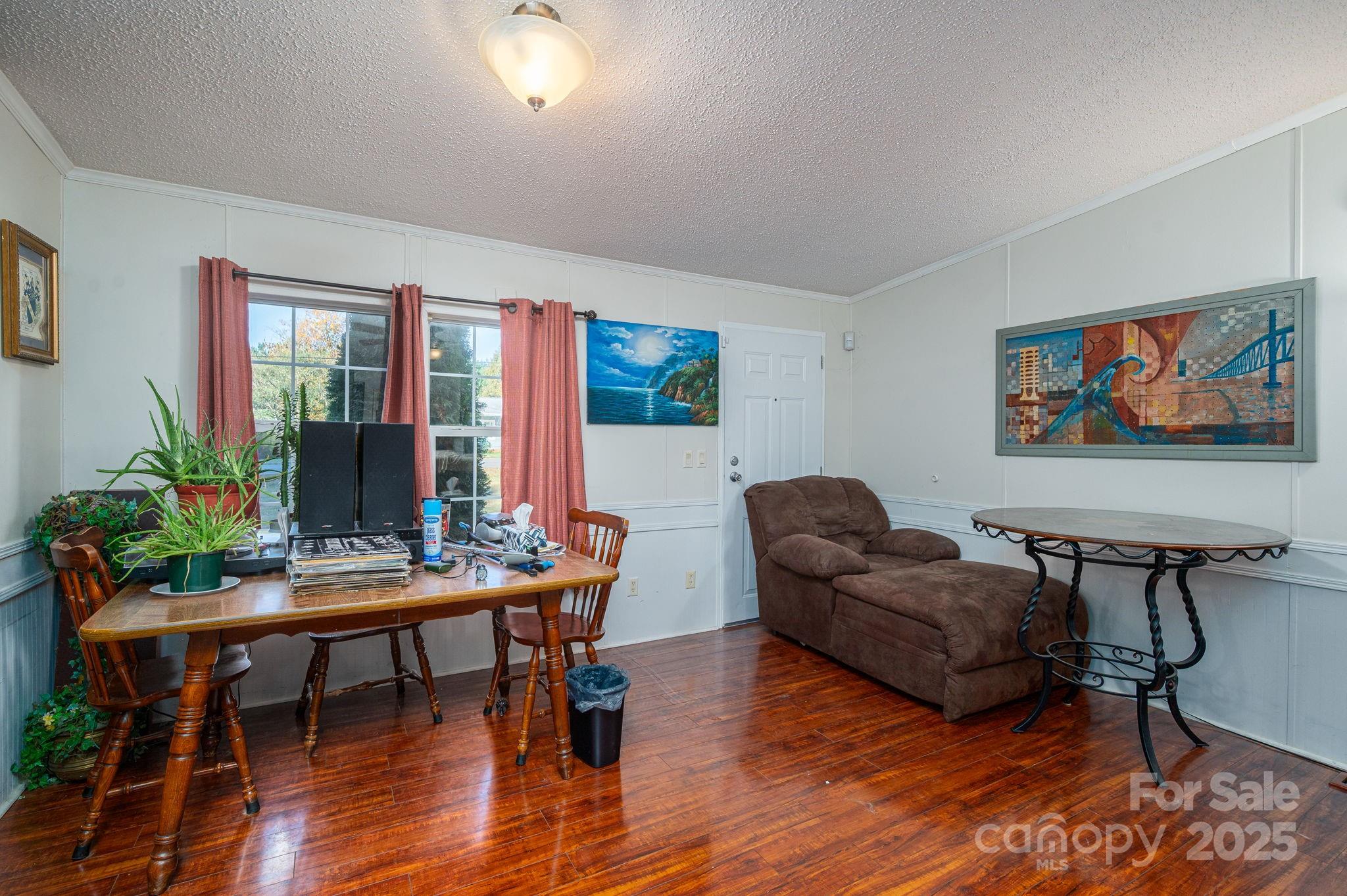 866 Marys Grove Road Cherryville, NC 28021 - Photo 13 of 24 a living room with furniture and a flat screen tv with wooden floor