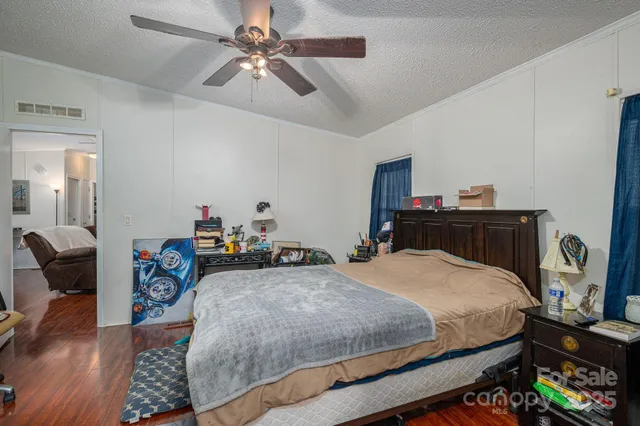 a bedroom with a bed and a table