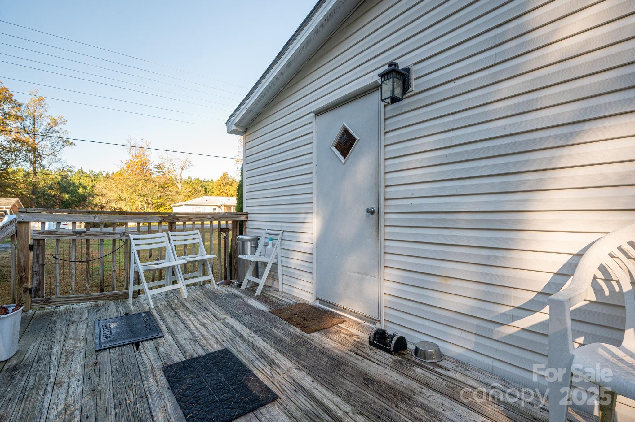 866 Marys Grove Road Cherryville, NC 28021 - Photo 5 of 24 a view of a balcony with wooden floor chairs and wooden floor