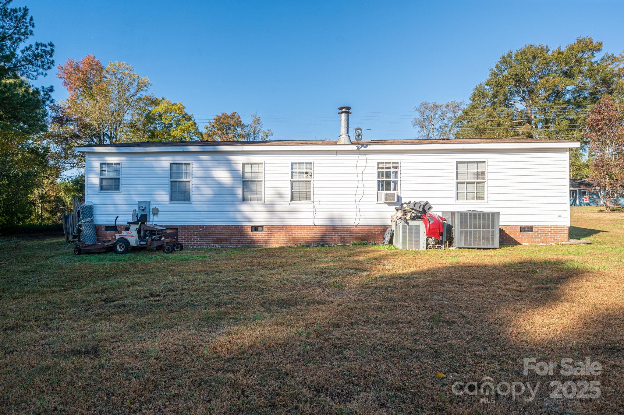 866 Marys Grove Road Cherryville, NC 28021 - Photo 6 of 24 a front view of house with yard and trees in the background