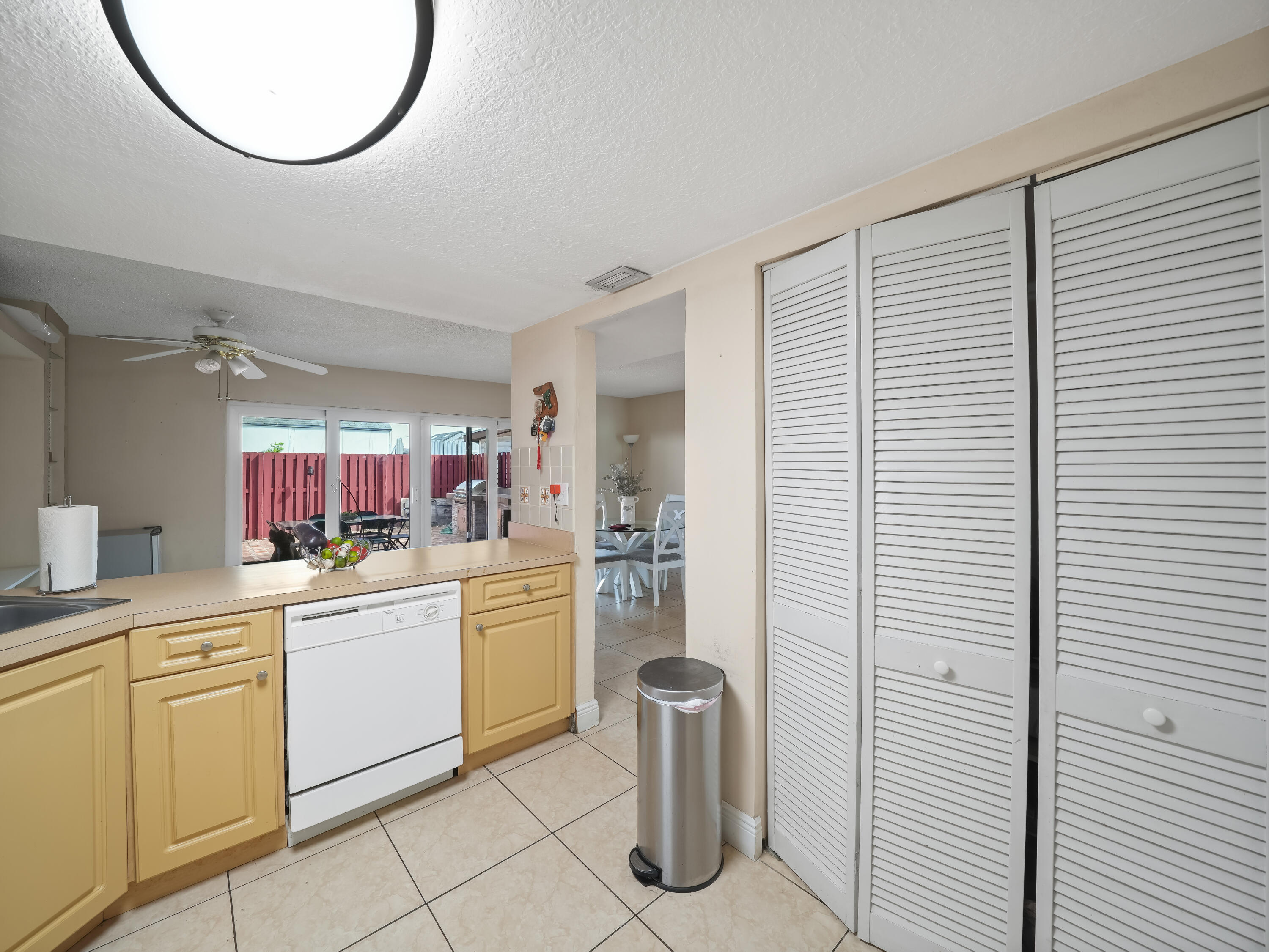 3672 Southwest 59th Terrace, Unit 73 Davie, FL 33314 - Photo 13 of 39 a kitchen with a sink and a refrigerator