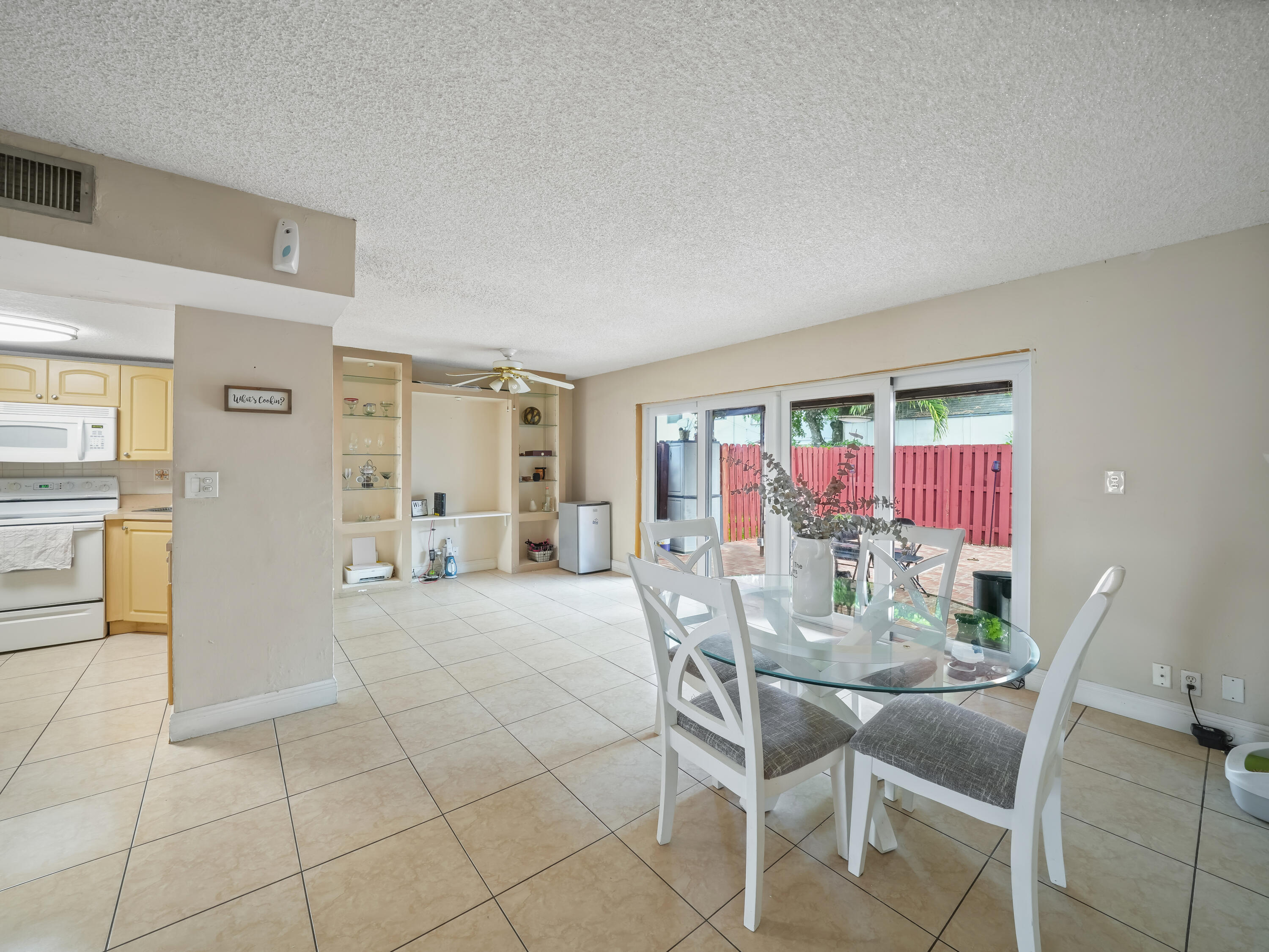 3672 Southwest 59th Terrace, Unit 73 Davie, FL 33314 - Photo 14 of 39 a view of a dining room with furniture and a chandelier