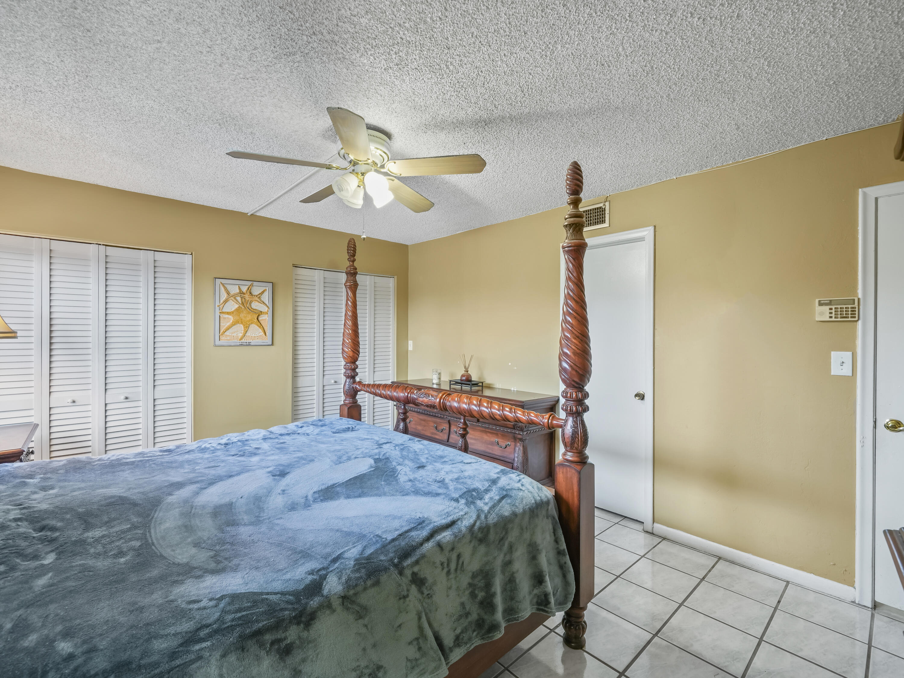 3672 Southwest 59th Terrace, Unit 73 Davie, FL 33314 - Photo 17 of 39 a bedroom with a bed dresser and a window