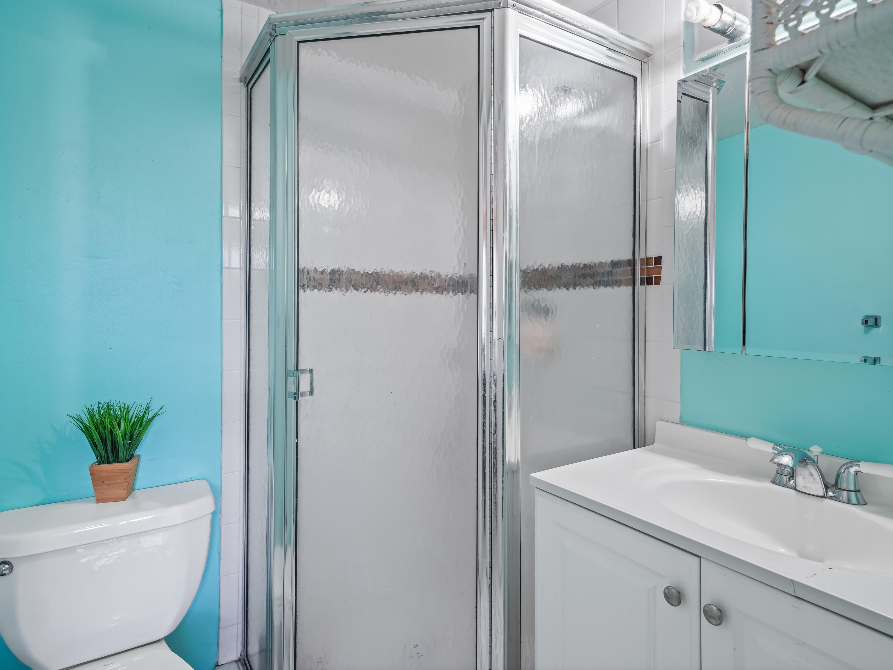 3672 Southwest 59th Terrace, Unit 73 Davie, FL 33314 - Photo 19 of 39 a bathroom with a sink toilet and shower