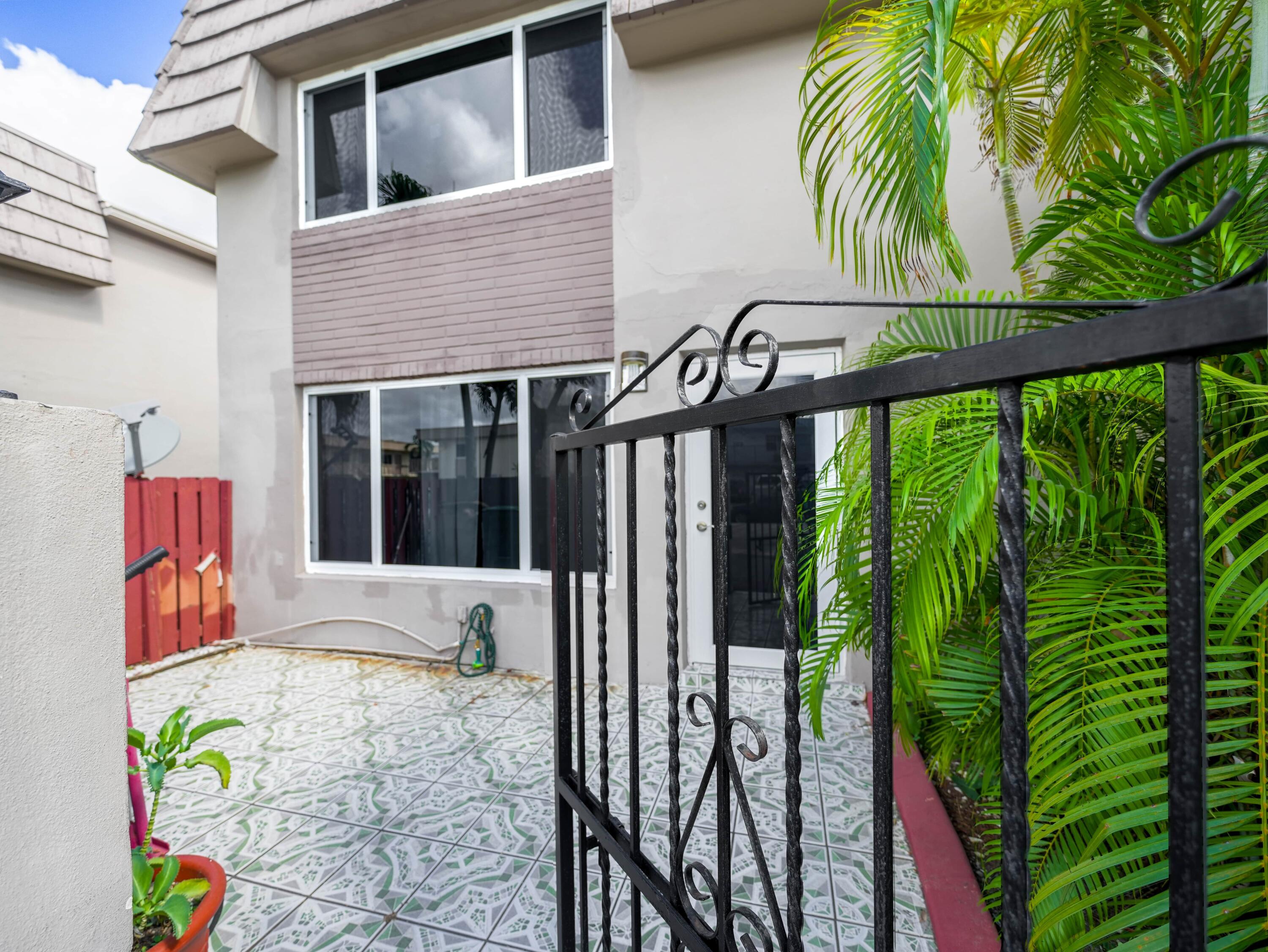 3672 Southwest 59th Terrace, Unit 73 Davie, FL 33314 - Photo 3 of 39 a view of a house with a porch