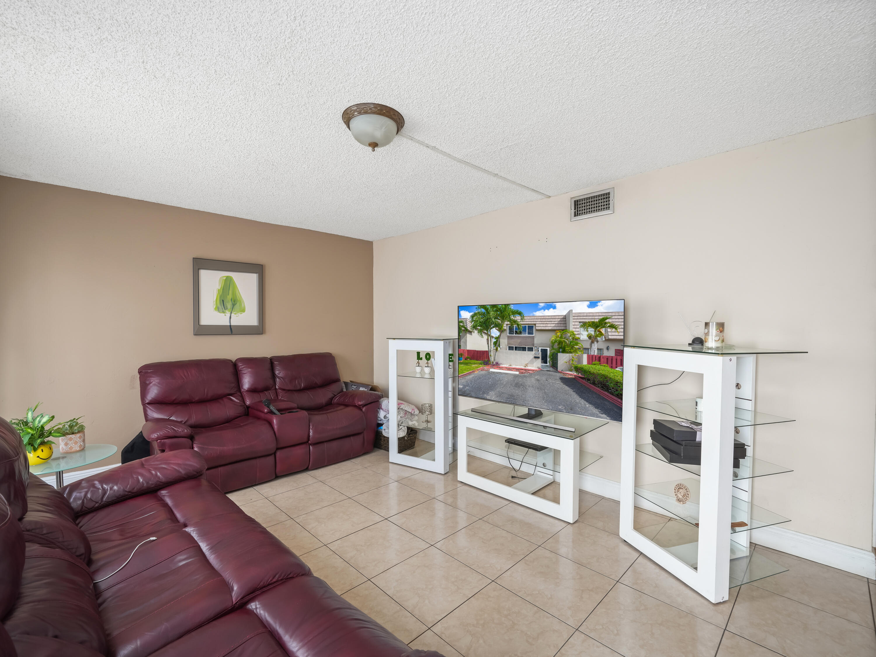 3672 Southwest 59th Terrace, Unit 73 Davie, FL 33314 - Photo 5 of 39 a livingroom with furniture and a couch