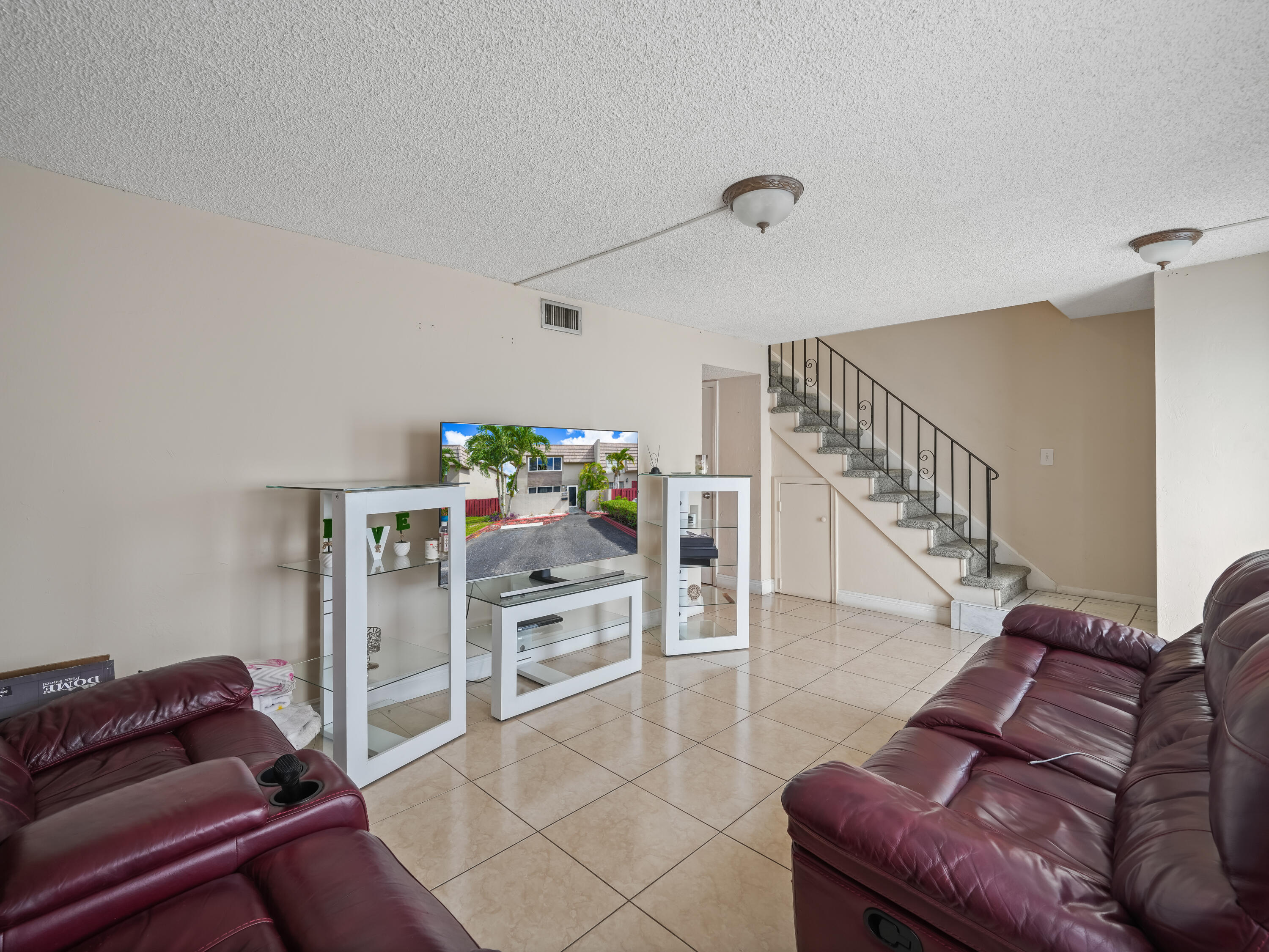 3672 Southwest 59th Terrace, Unit 73 Davie, FL 33314 - Photo 6 of 39 a living room with furniture