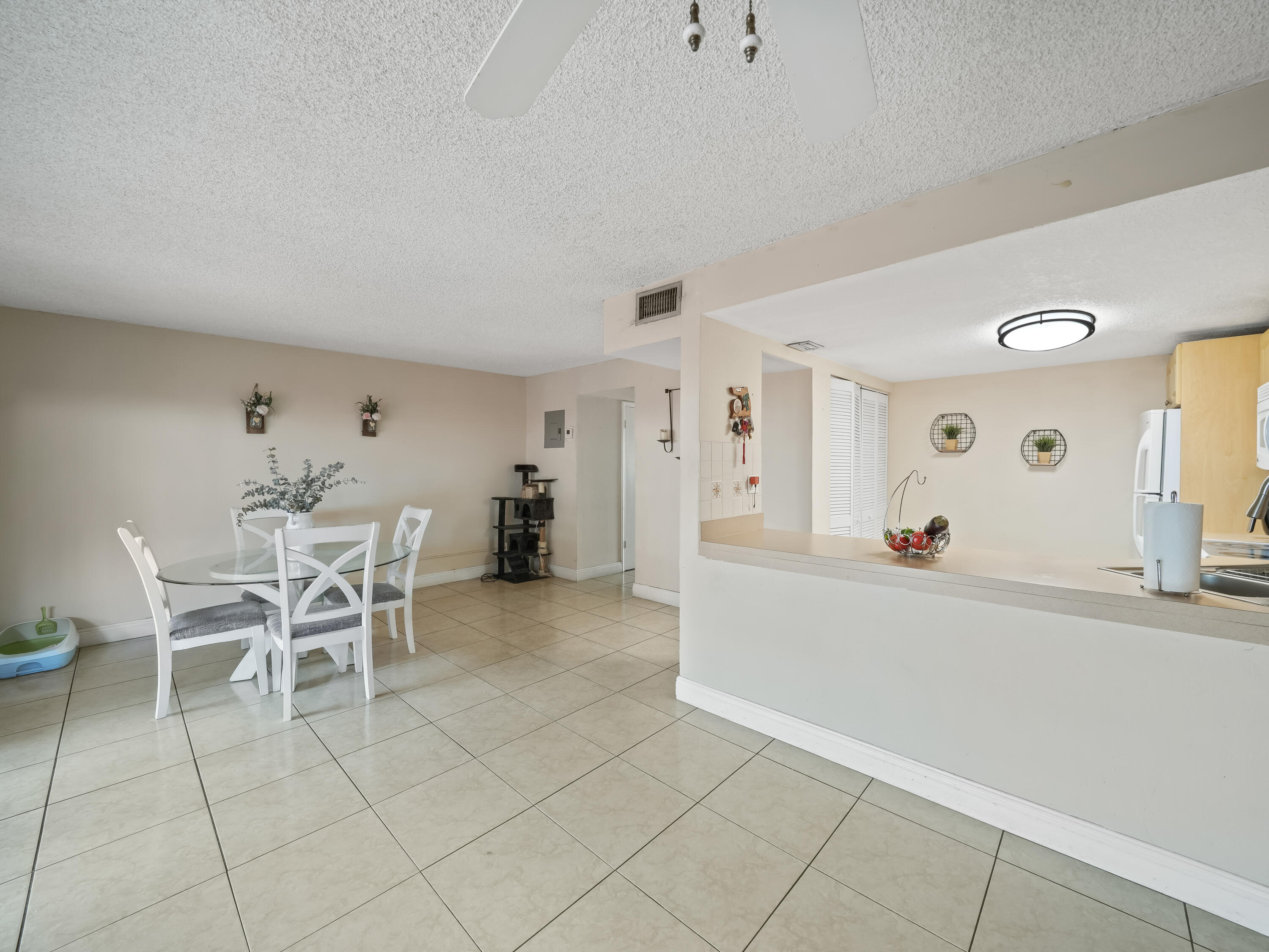 3672 Southwest 59th Terrace, Unit 73 Davie, FL 33314 - Photo 10 of 39 a view of a dining room with furniture and chandelier