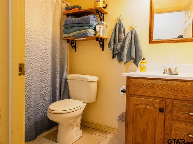 a bathroom with a toilet and a sink