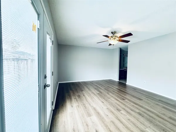 a view of an empty room with a window