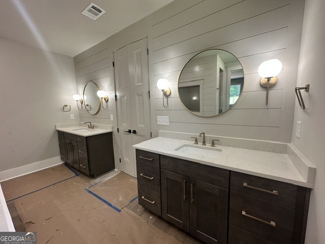 106 Equestrian Drive Forsyth, GA 31029 - Photo 7 of 52 a bathroom with a double vanity sink and a mirror