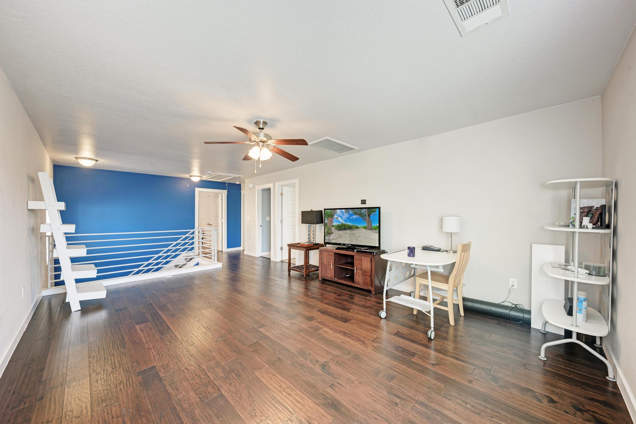 5305 Ingersoll Lane Austin, TX 78744 - Photo 15 of 27 a living room with furniture and a wooden floor