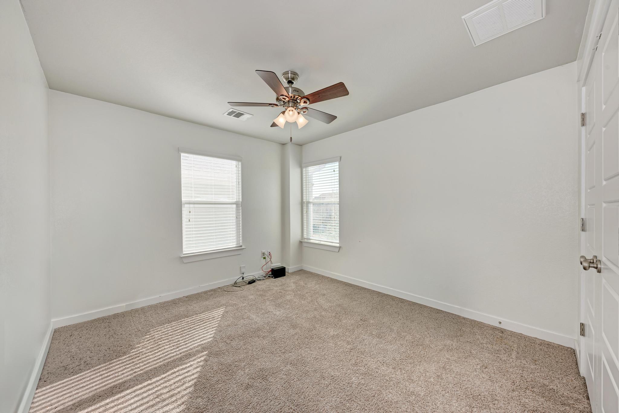 5305 Ingersoll Lane Austin, TX 78744 - Photo 19 of 27 a view of an empty room with a window