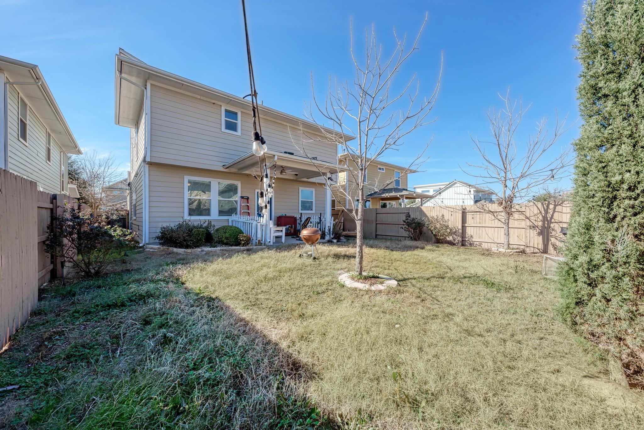 5305 Ingersoll Lane Austin, TX 78744 - Photo 23 of 27 a backyard of a house with plants and outdoor seating