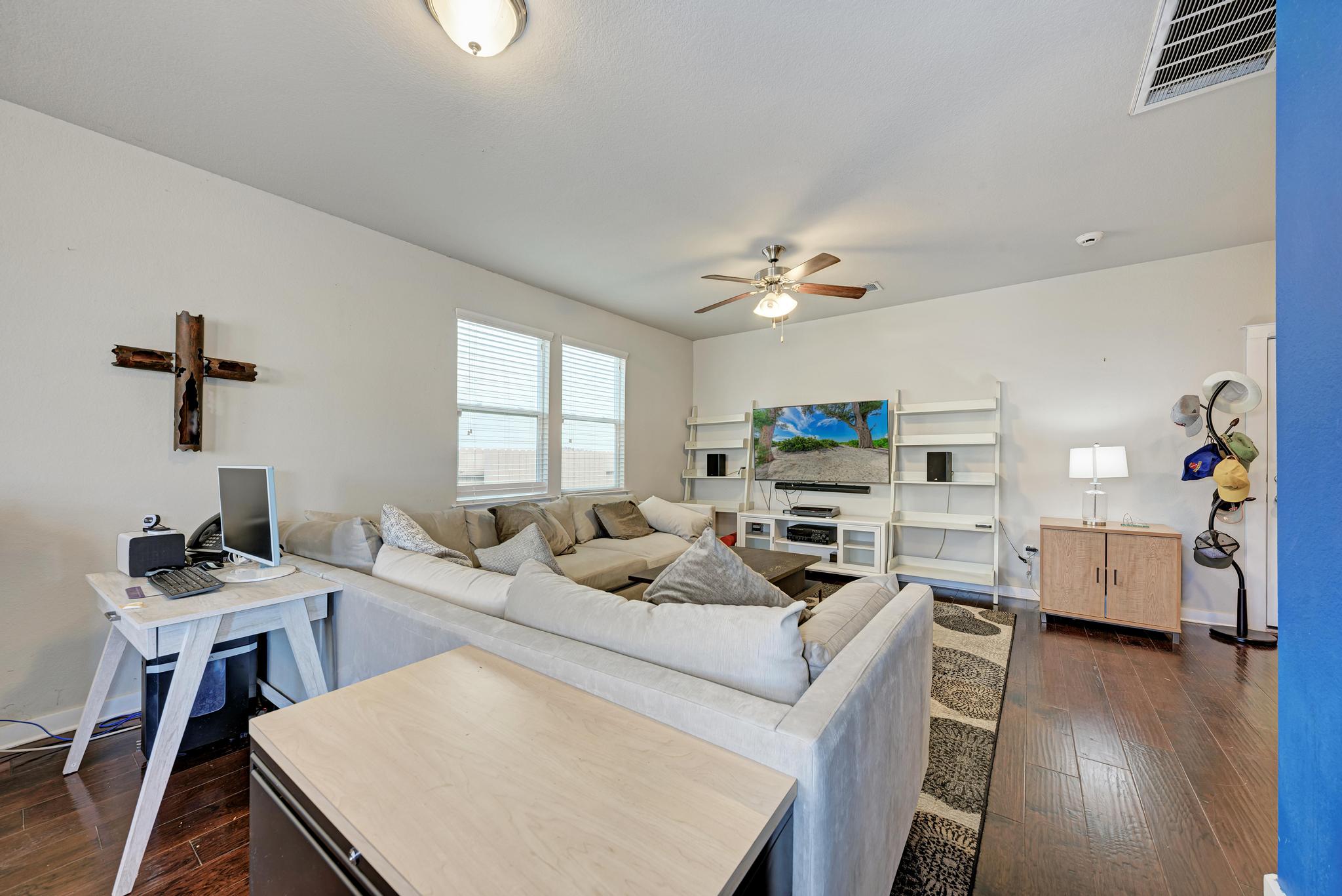5305 Ingersoll Lane Austin, TX 78744 - Photo 5 of 27 a living room with furniture and a flat screen tv