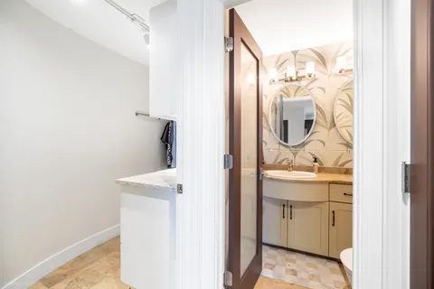 a bathroom with a sink and mirror