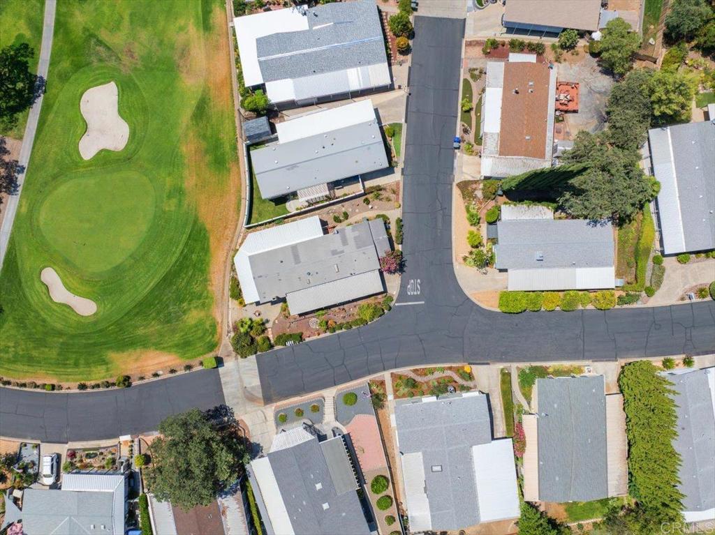 18218 Paradise Mountain Road, Unit 116 Valley Center, CA 92082 - Photo 34 of 35 aerial view of a house with swimming pool and garden