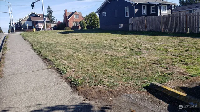 a view of a house with brick walls and potted plants