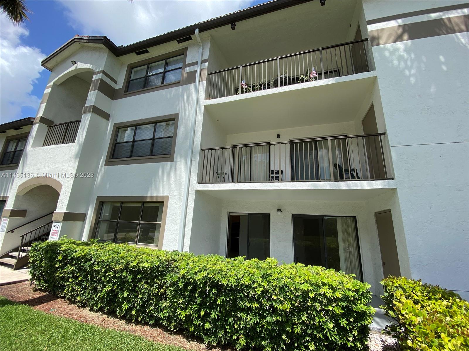 610 South Park Road, Unit 151 Hollywood, FL 33021 - Photo 3 of 34 a building view with a garden space