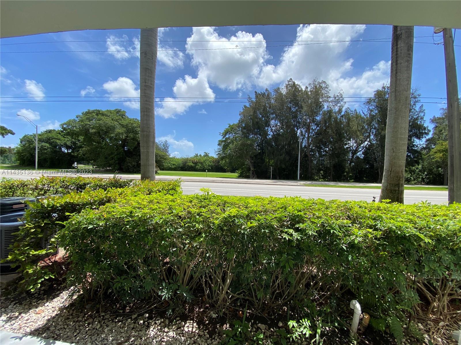 610 South Park Road, Unit 151 Hollywood, FL 33021 - Photo 7 of 34 a view of a field with an tree and a yard
