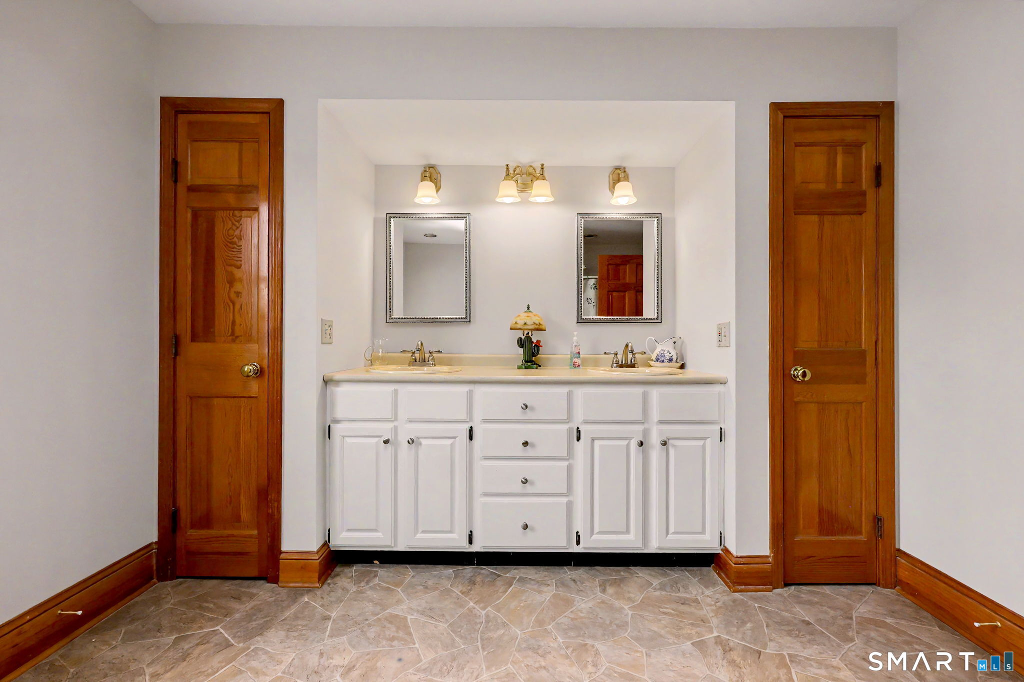 7 Merrill Road Trumbull, CT 06611 - Photo 24 of 40 a bathroom with a sink and a mirror